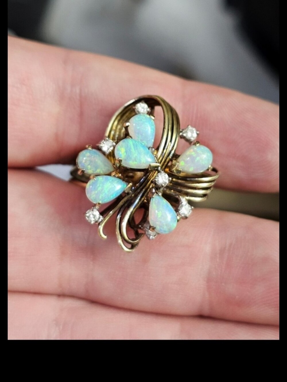 14k opal & diamond ring size 7. This is a large ring! The opals are amazing with